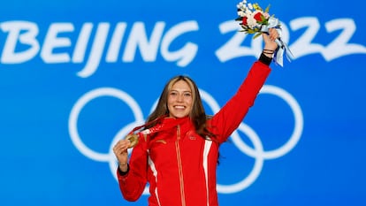 Eileen Gu celebrates her gold medal on the podium at Beijing 2022.