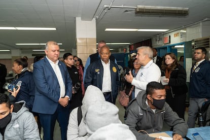 Eric Adams visits a high school that has been turned into a shelter in February 2023.