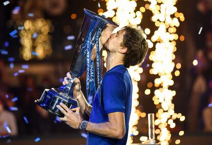 Germany's Alexander Zverev celebrates with the trophy after winning against Russia's Daniil Medvedev during their final match of the ATP Finals at the Pala Alpitour venue in Turin on November 21, 2021. (Photo by Marco BERTORELLO / AFP)