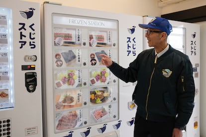 Konomu Kubo, a spokesperson for Kyodo Senpaku Co. explains how whale meat is being sold from a vending machine at the firm's store, Thursday, Jan. 26, 2023, in Yokohama, Japan.