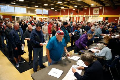 Crowds of people line up to get a ballot at a Republican caucus site, Feb. 23, 2016, in Las Vegas.