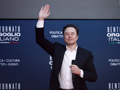 Elon Musk greets the audience at an event held by the fascist Brothers of Italy party in Rome, on Saturday, December 16, 2023.