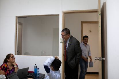 Bernardo Arévalo speaks with his team at his campaign headquarters.