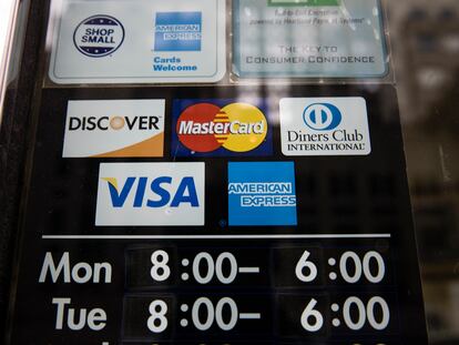 Credit card options are shown on a store's door on Nov. 29, 2018 in Philadelphia.