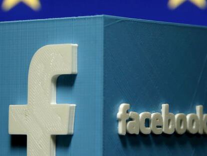 El logo de Facebook en 3D junto a la bandera comunitaria. 