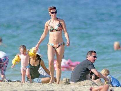 David Cameron relaxes on a Mallorca beach with his wife, Samantha, and daughter, Florence. 