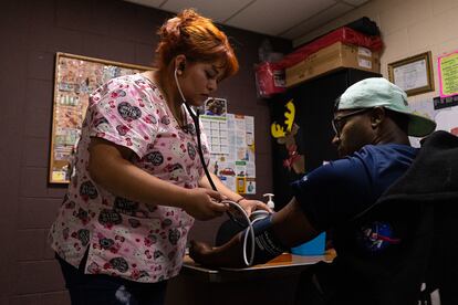 Flor de los Ángeles López, a nurse at the Casa del Migrante in Guatemala City, attends to Venezuelan migrants, January 10, 2024.