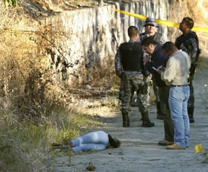 Forensic experts collect evidence around the body of Venezuelan model Daisy Yenire Ferrer Arenas that was found lifeless on a dirt road 