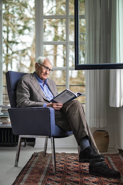 Jürgen Habermas reads in the living room of his home in Starnberg, near Munich.