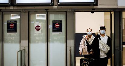 Passengers from Beijing arriving in Paris.