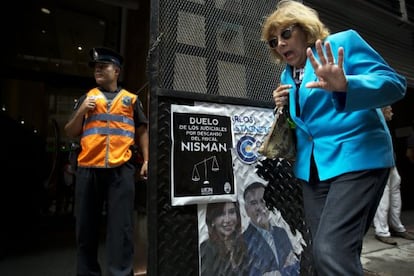 A woman passes the office of prosecutor Viviana Fein.