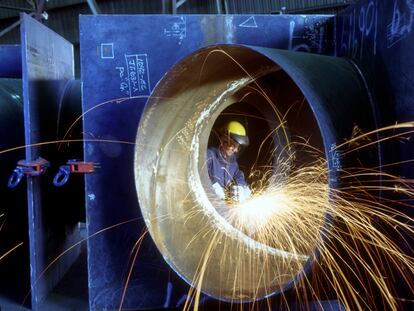 Woman Welder Working in Steel Water Pipe