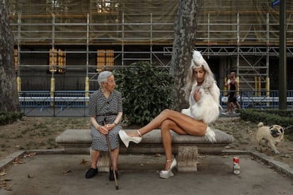 A local resident and a reveler in Chueca during Gay Pride 2016.