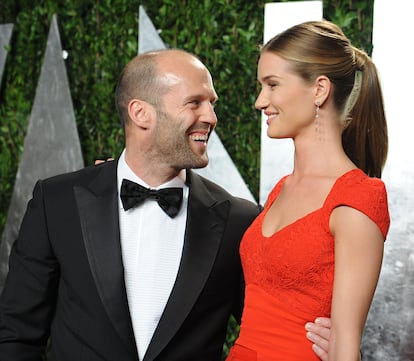 Jason Statham and his partner, actress Rosie Huntington-Whiteley, at the Vanity Fair post-Oscars party in 2012. 