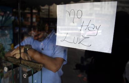 "No electricity" reads a sign in a closed shop in Caracas.