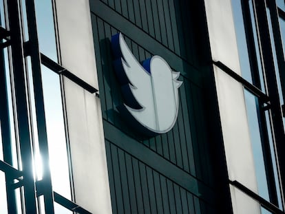 A Twitter logo hangs outside the company's offices in San Francisco.