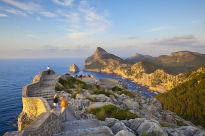 Tourists walking along Cape Formentor on the island of Mallorca.