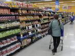 (FILES) In this file photo taken on August 15, 2019 customers shop at a supermarket in Buenos Aire. - Inflation in Argentina reached 3,8% on October and accumulates 26,9% in 2020, one of the highest rates in the region, informed the state Institute of Statistics (Indec) on November 12, 2020. (Photo by JUAN MABROMATA / AFP)