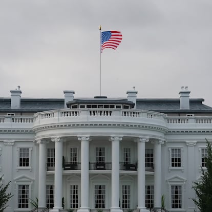 The White House in Washington DC, USA, South front Portico facing trees and garden.
Official residence and workplace of the president of the United States.
Scenic view of the iconic portico and the american flag in cloudy day.
1:30 scale model