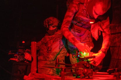 A Ukrainian soldier from the 3rd Assault Brigade prepares a drone with explosives before flying over Russian positions in the Kharkiv region, August 24.