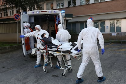 A coronavirus patient is moved in Italy on February 22.