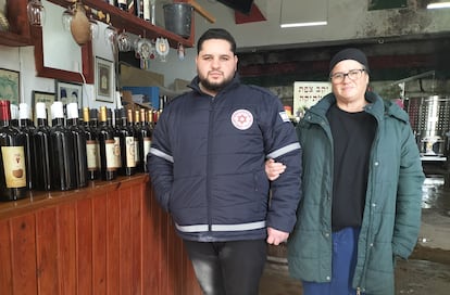 Keren Hodaya Alon with her eldest son, Yoshua, in her wine cellar in the Israeli city of Safed, on Thursday.