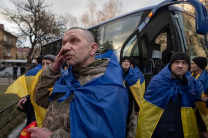 Ukrainian servicemen react after returning from captivity during a POWs exchange between Russia and Ukraine, in Chernyhiv region, Ukraine, Wednesday, March 19, 2025. (AP Photo/Efrem Lukatsky)