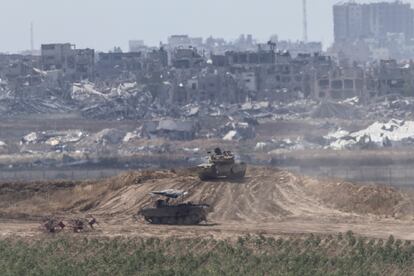 Israeli tanks move through the southern Strip, near the border between Israel and Gaza, May 13.