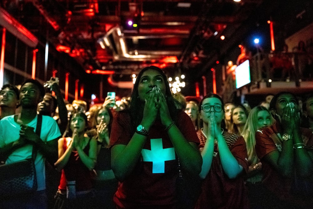 Swiss fans react as they watch the 2026 FIFA World Cup soccer round of 16 soccer match between Switzerland and Colombia at a public viewing in Zurich, Switzerland on Tuesday, July 7, 2026. (Claudio Thoma/Keystone via AP)