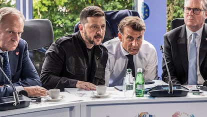 TIRANA, ALBANIA - MAY 16: (EDITORS NOTE: This Handout image was provided by a third-party organization and may not adhere to Getty Images editorial policy.) In this handout image provided by the German Government Press Office (BPA), (LtoR) Poland's Prime Minister Donald Tusk, Ukrainian President Volodymyr Zelensky, French President Emmanuel Macron, Britain's Prime Minister Keir Starmer and Germany's Chancellor Friedrich Merz, hold a telephone conversation with US President Trump on the sidelines of a meeting at the 6th European Political Community summit on May 16, 2025 at Skanderbeg Square in Tirana, Albania. The EPC brings together heads of state and government from the 27 European Union countries and 20 others. The items on today's agenda are security and democratic resilience, competitiveness and economic security, and mobility challenges and youth empowerment. (Photo by KuglerSteffen/Bundesregierung via Getty Images)