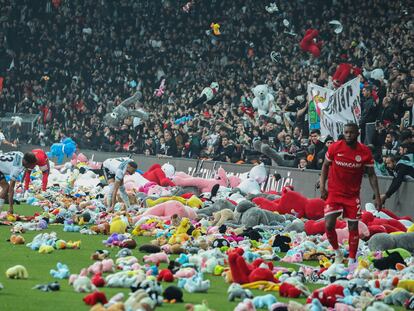 Fans throw toys onto the pitch during the Turkish Super League soccer match between Besiktas and Antalyaspor at the Vodafone stadium in Istanbul, Turkey, Sunday, Feb. 26, 2023. During the match, supporters threw a massive number of soft toys to be donated to children affected by the powerful earthquake on Feb. 6 on southeast Turkey. (AP Photo)