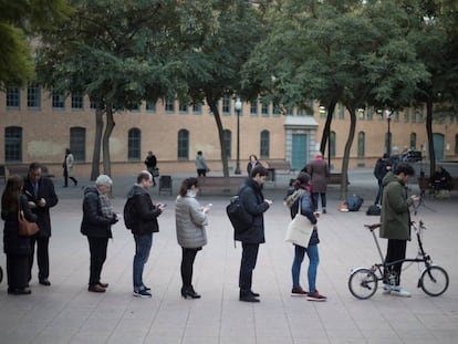 Barcelona voters wait in line to cast their vote in the Catalan election.