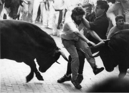 Runners and bulls collide at an encierro in 1988.