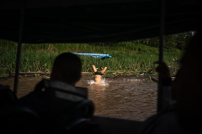 Children play in the Amazon River in the Colombian Amazon on December 13, 2024.