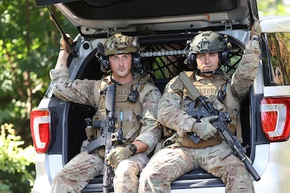 Heavily armed law enforcement officers move along Rt. 52 as the search continues for Danelo Cavalcante in Pocopson Township, Pa., on Sunday, Sept. 3, 2023.