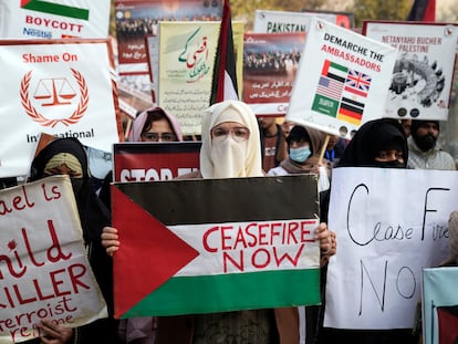 Pakistani people hold placards during a protest against Israeli airstrikes and to show solidarity with Palestinian people in Gaza, in Lahore, Pakistan, Saturday, Jan. 27, 2024. (AP Photo/K.M. Chaudary)