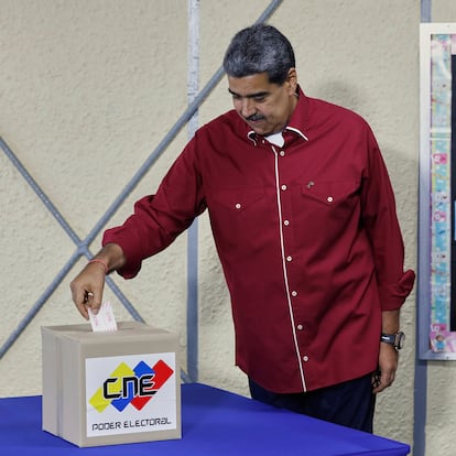 Venezuela's President Nicolas Maduro votes in legislative and local elections in Caracas, Venezuela, Sunday, May 25, 2025. (AP Photo/Cristian Hernandez)