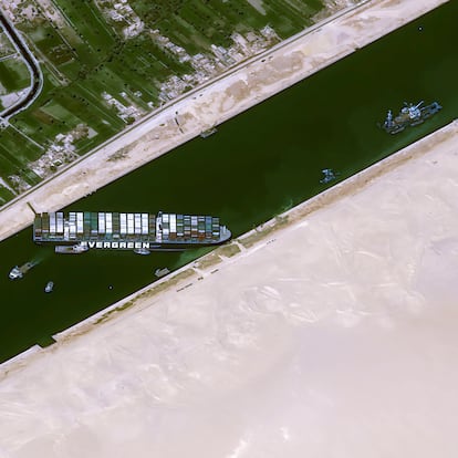This satellite image from Cnes2021, Distribution Airbus DS, shows the cargo ship MV Ever Given stuck in the Suez Canal near Suez, Egypt, Thursday, March 25, 2021. The skyscraper-sized cargo ship wedged across Egypt's Suez Canal further imperiled global shipping Thursday as at least 150 other vessels needing to pass through the crucial waterway idled waiting for the obstruction to clear, authorities said. (Cnes2021, Distribution Airbus DS via AP)