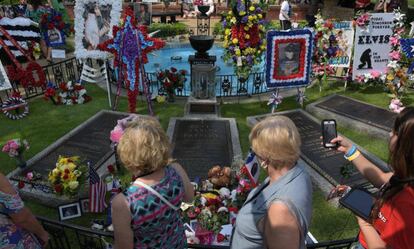 Elvis Presley fans visit his grave in Memphis on August 12. 