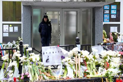 A police officer guards the Vladimir Ribnikar school in Belgrade, Serbia