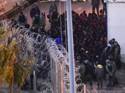 Moroccan police stop migrants from crossing into the Spanish exclave city of Ceuta in this file photo.
