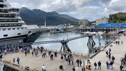 Passengers disembark from a cruise ship that has docked on June 12, 2023, in downtown Juneau, Alaska