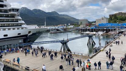 Passengers disembark from a cruise ship that has docked on June 12, 2023, in downtown Juneau, Alaska