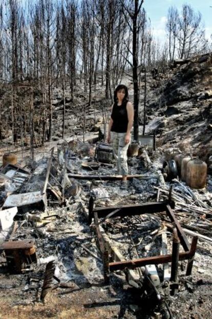 Trinidad Tirado with the remains of her caravan.