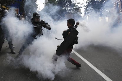 Police and protestors clash on Sunday in Bogota.