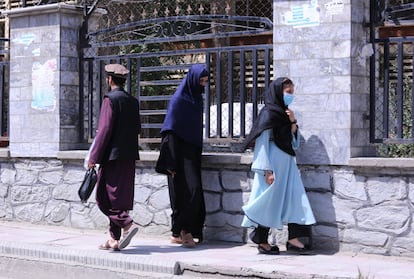 Women walking down a street in Kabul, Afghanistan, in August.