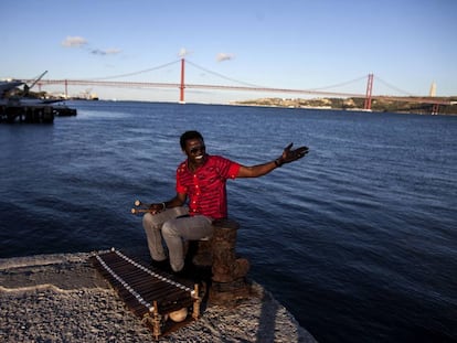 Guinea-Bissau-born Kimi Djabate with his balafon on the banks of the River Tajo. Lisbon's music scene is vibrant and varied.