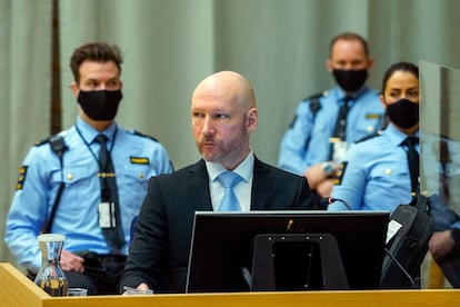 Convicted mass murderer Anders Behring Breivik sits in the makeshift courtroom in Skien prison on the second day of his hearing where he is requesting release on parole, in Skien, Norway, Jan. 19, 2022.