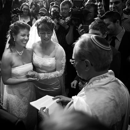 DENVER, CO - MAY 1: Anna (L) and Fran Simon, both of Denver, Colorado, are the first same-sex couple to be issued a Civil Union license at a midnight ceremony in the Denver Office of the Clerk and Recorder, at the Wellington E. Webb Municipal Office Building on May 1, 2013 in Denver, Co. Colorado is the eighth state to have civil unions or similar laws implemented, permitting unmarried couples, both gay and heterosexual, the ability to form civil unions and get similar rights to those of married couples. (Photo by Marc Piscotty/Getty Images)