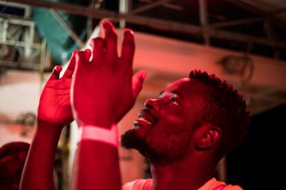 One of the rescued migrants thanks God after being picked up by the crew, on June 9.